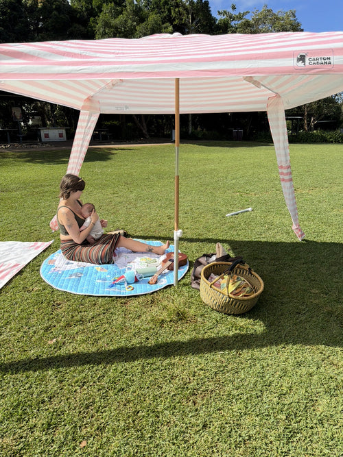 Sorbet Cabana on grass with a mother and baby in the shade